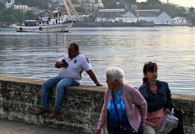 The vessel Maguro, arriving from Mexico with humanitarian aid as part of the Nuestra America convoy, docks at the port of Havana on March 24, 2026. (Photo by YAMIL LAGE / AFP)