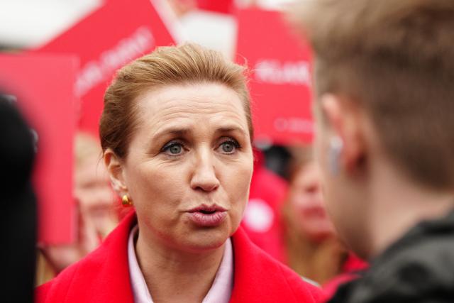 Denmark's Prime Minister and Social Democrats' leader Mette Frederiksen, is pictured on the street at Nytorv in Aalborg, on March 24, 2026 during the parliamentary election in Denmark. Danes vote on March 24, 2026 in general elections, with Prime Minister Mette Frederiksen seen as the favourite after standing up to US President Donald Trump over Greenland. (Photo by Henning Bagger / Ritzau Scanpix / AFP) / Denmark OUT