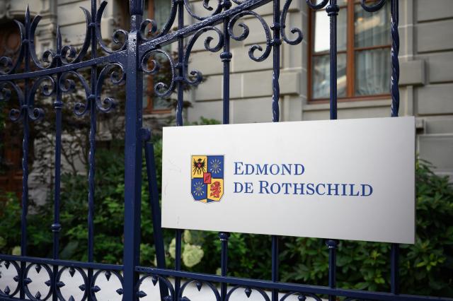 (FILES) The logo of Swiss private banking Edmond de Rothschild is pictured on the facade of a building hosting a branch of the bank, in Lausanne, on August 19, 2020. The headquarters of Edmond de Rothschild bank in Paris was searched on March 24, 2026, as part of a National Financial Prosecutor's Office investigation into alleged corruption of public officials involving French diplomat Fabrice Aidan, cited in the Epstein files. (Photo by Fabrice COFFRINI / AFP)