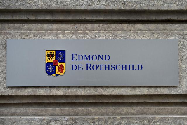 (FILES) This picture taken on March 8, 2016, shows a sign of the Swiss private banking Edmond de Rothschild at its headquarters on March 8, 2016 in Geneva. The headquarters of Edmond de Rothschild bank in Paris was searched on March 24, 2026, as part of a National Financial Prosecutor's Office investigation into alleged corruption of public officials involving French diplomat Fabrice Aidan, cited in the Epstein files. (Photo by FABRICE COFFRINI / AFP)