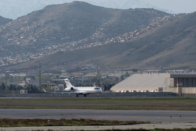A chartered aircraft carrying US citizen Dennis Coyle upon his release by the Taliban, prepares to take off from the airport in Kabul on March 24, 2026. Afghanistan's Taliban government announced on March 24 that it was freeing a US national who had been detained for more than a year. The foreign ministry said the family of linguist and researcher Dennis Coyle had written to the supreme leader of Afghanistan, requesting his release for Eid. (Photo by Wakil KOHSAR / AFP)