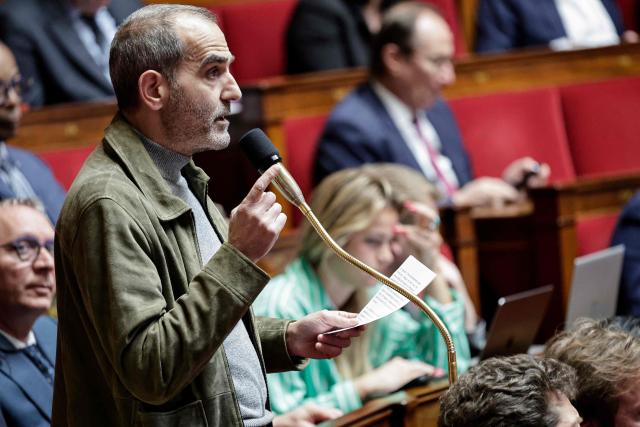 Ecologiste et Social's MP Pouria Amirshahi speaks during a session of questions to the government at The National Assembly, France's lower house of parliament in Paris on March 24, 2026. (Photo by STEPHANE DE SAKUTIN / AFP)