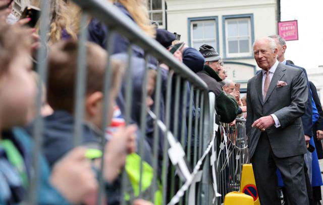 Britain's King Charles III meets members of the public during a visit to St Austell, south-west England on March 24, 2026. (Photo by Adrian DENNIS / POOL / AFP)