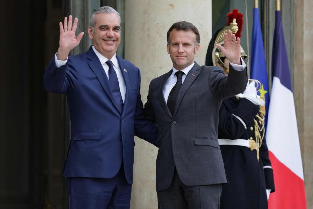 France's President Emmanuel Macron welcomes Dominican Republic's President Luis Abinader before a meeting at The Elysee Presidential Palace in Paris on March 24, 2026. (Photo by Ludovic MARIN / AFP)