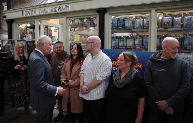Britain's King Charles III meets members of the local community with during a visit to The Market Hall in St Austell, south-west England on March 24, 2026. (Photo by Adrian DENNIS / POOL / AFP)