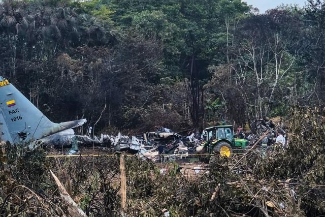 View of the wreckage of the Air Force Hercules that crashed during takeoff in Puerto Leguizamo, Colombia, near the southern border with Ecuador, on March 24, 2026. A Colombian military plane carrying 125 soldiers and crew members crashed on takeoff early on March 23, killing at least 66 people and injuring dozens more, officials said. (Photo by daniel ortiz / AFP)