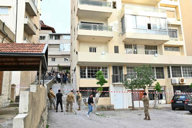 Lebanese soldiers stand at the site where, according to Lebanese authorities, fragments from a missile interception fell in the town of Sahel Alma, north of Beirut, on March 24, 2026. Explosions rocked several areas north of Beirut that have so far been spared in the ongoing Israel-Hezbollah war, according to residents and local media, with a military official saying the blasts likely came from an intercepted Iranian missile. (Photo by FADEL itani / AFP)