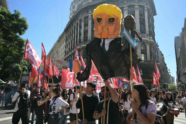 A large effigy is carried by demonstrators while heading to Plaza de Mayo Square to commemorate the 50th anniversary of the military coup in Buenos Aires on March 24, 2026. In Argentina, March 24th is a day of mourning, marches and political disputes. Fifty years on from the coup d’etat, thousands of people are taking to the streets again to commemorate the victims of a dictatorship that the government of far-right leader Javier Milei is seeking to rewrite. (Photo by Juan Mabromata / AFP)