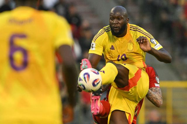 (FILES) Belgium's forward #10 Romelu Lukaku (R) controls the ball in the air during the FIFA World Cup 2026 Group J European qualification football match between Belgium and Wales at the King Baudouin Stadium in Brussels on June 9, 2025. Belgium's all-time leading goalscorer Romelu Lukaku will miss his country's visit to the United States for two 2026 World Cup warm-up matches, the Belgian football federation (RBFA) announced on March 24, 2026. (Photo by NICOLAS TUCAT / AFP)