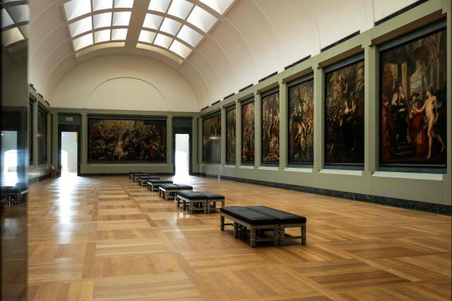 This photograph shows a general view of The Medicis Gallery, in which are displayed 24 paintings by Flemish artist Peter Paul Rubens constituting the 'Marie de Medici Cycle', before their restoration, at Musee du Louvre in Paris on March 24, 2026. The Louvre has unveiled the details of an “exceptional operation” to restore the 24 paintings of the “Marie de’ Medici Cycle,” painted in the early 17th century by Rubens, one of the masters of Flemish painting. A call for tenders is underway to find two teams of restorers who will work simultaneously, starting in the autumn, on a project expected to last four years. (Photo by Blanca CRUZ / AFP)