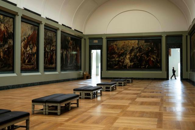TOPSHOT - This photograph shows a general view of The Medicis Gallery, in which are displayed 24 paintings by Flemish artist Peter Paul Rubens constituting the 'Marie de Medici Cycle', before their restoration, at Musee du Louvre in Paris on March 24, 2026. The Louvre has unveiled the details of an “exceptional operation” to restore the 24 paintings of the “Marie de’ Medici Cycle,” painted in the early 17th century by Rubens, one of the masters of Flemish painting. A call for tenders is underway to find two teams of restorers who will work simultaneously, starting in the autumn, on a project expected to last four years. (Photo by Blanca CRUZ / AFP)