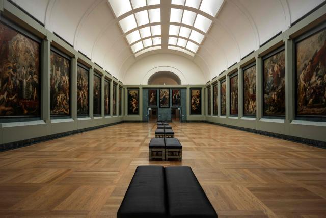 This photograph shows a general view of The Medicis Gallery, in which are displayed 24 paintings by Flemish artist Peter Paul Rubens constituting the 'Marie de Medici Cycle', before their restoration, at Musee du Louvre in Paris on March 24, 2026. The Louvre has unveiled the details of an “exceptional operation” to restore the 24 paintings of the “Marie de’ Medici Cycle,” painted in the early 17th century by Rubens, one of the masters of Flemish painting. A call for tenders is underway to find two teams of restorers who will work simultaneously, starting in the autumn, on a project expected to last four years. (Photo by Blanca CRUZ / AFP)