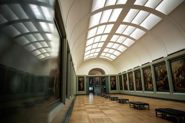 This photograph shows a general view of The Medicis Gallery, in which are displayed 24 paintings by Flemish artist Peter Paul Rubens constituting the 'Marie de Medici Cycle', before their restoration, at Musee du Louvre in Paris on March 24, 2026. The Louvre has unveiled the details of an “exceptional operation” to restore the 24 paintings of the “Marie de’ Medici Cycle,” painted in the early 17th century by Rubens, one of the masters of Flemish painting. A call for tenders is underway to find two teams of restorers who will work simultaneously, starting in the autumn, on a project expected to last four years. (Photo by Blanca CRUZ / AFP)