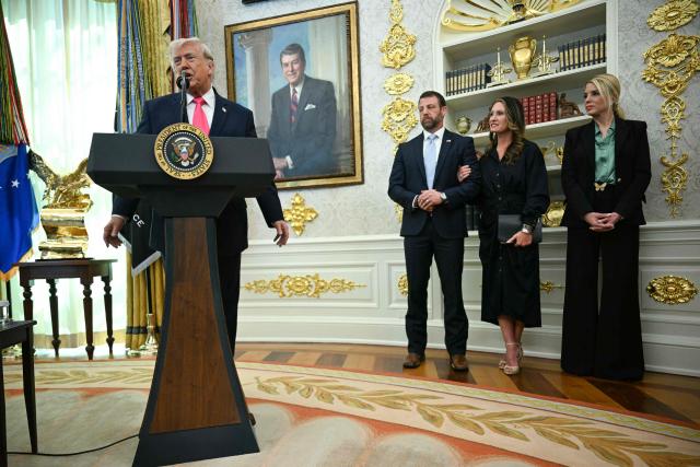 US President Donald Trump speaks before the swearing in of the new Homeland Security Secretary Markwayne Mullin (3rd R) as his wife Chritine Mullin (2nd R) and Attorney General Pam Bondi (R) look on in the Oval Office of the White House in Washington, DC, on March 24, 2026. The US Senate on Monday confirmed Mullin as the new chief of the Department of Homeland Security (DHS), the agency reeling from a partial government shutdown as it works to enforce President Donald Trump's immigration crackdown. (Photo by Jim WATSON / AFP)