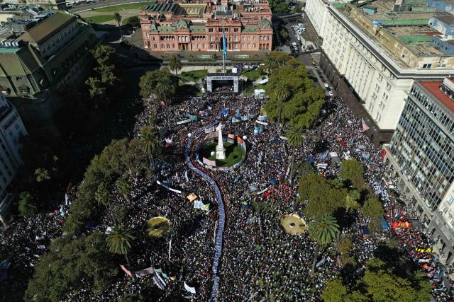 Aerial people gathering at Mayo Square on the 50th anniversary of the beginning of the last military dictatorship (1976-1983) in Buenos Aires on March 24, 2026. In Argentina, March 24th is a day of mourning, marches and political disputes. Fifty years on from the coup d’etat, thousands of people are taking to the streets again to commemorate the victims of a dictatorship that the government of far-right leader Javier Milei is seeking to rewrite. (Photo by Juan Mabromata / AFP)