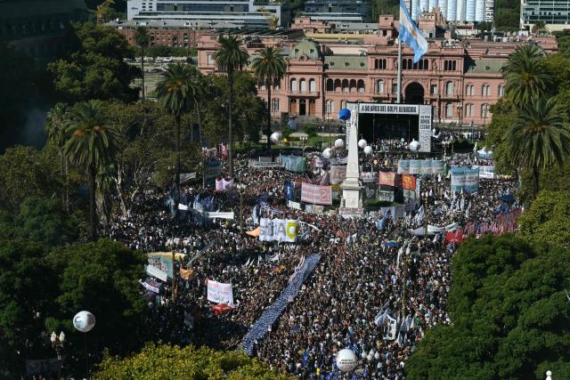 Aerial people gathering at Mayo Square on the 50th anniversary of the beginning of the last military dictatorship (1976-1983) in Buenos Aires on March 24, 2026. In Argentina, March 24th is a day of mourning, marches and political disputes. Fifty years on from the coup d’etat, thousands of people are taking to the streets again to commemorate the victims of a dictatorship that the government of far-right leader Javier Milei is seeking to rewrite. (Photo by Juan Mabromata / AFP)