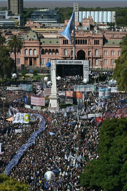 Aerial people gathering at Mayo Square on the 50th anniversary of the beginning of the last military dictatorship (1976-1983) in Buenos Aires on March 24, 2026. In Argentina, March 24th is a day of mourning, marches and political disputes. Fifty years on from the coup d’etat, thousands of people are taking to the streets again to commemorate the victims of a dictatorship that the government of far-right leader Javier Milei is seeking to rewrite. (Photo by Juan Mabromata / AFP)