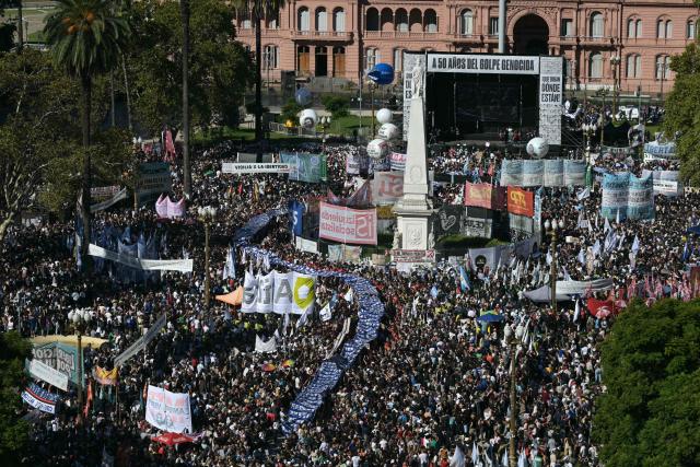 Aerial people gathering at Mayo Square on the 50th anniversary of the beginning of the last military dictatorship (1976-1983) in Buenos Aires on March 24, 2026. In Argentina, March 24th is a day of mourning, marches and political disputes. Fifty years on from the coup d’etat, thousands of people are taking to the streets again to commemorate the victims of a dictatorship that the government of far-right leader Javier Milei is seeking to rewrite. (Photo by Juan Mabromata / AFP)