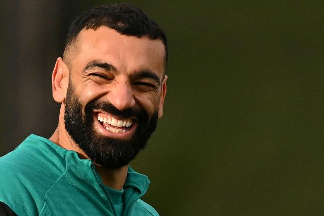 (FILES) Liverpool's Egyptian striker #11 Mohamed Salah smiles as he attends a team training session at their training ground in Kirkby, Liverpool, north-west England on January 20, 2026, on the eve of their UEFA Champions League, league phase football match against Olympique Marseille in Marseille. Mohamed Salah is to leave Liverpool at the end of this season, the Premier League champions announced on March 24, 2026. The 33-year-old Egyptian forward arrived at Anfield from Roma in 2017 and has made 435 appearances for Liverpool, scoring 255 goals. (Photo by Oli SCARFF / AFP)