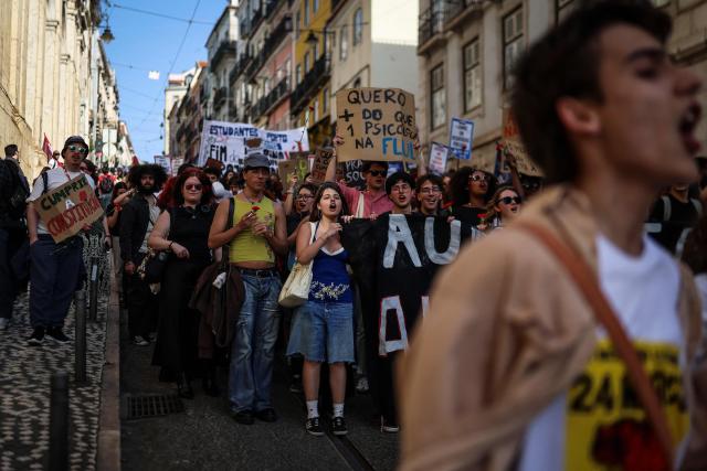 Students demonstrate to ask affordable housing, an end to tuition fees, and investment in social programs in Lisbon on March 24, 2026. University students across the country  demonstrate on “Student Day" to demand affordable housing, an end to tuition fees, and investment in social programs. (Photo by PATRICIA DE MELO MOREIRA / AFP)