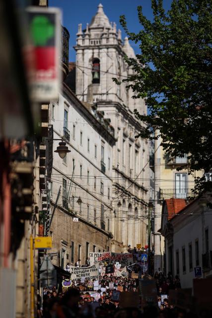 Students demonstrate to ask affordable housing, an end to tuition fees, and investment in social programs in Lisbon on March 24, 2026. University students across the country  demonstrate on “Student Day" to demand affordable housing, an end to tuition fees, and investment in social programs. (Photo by PATRICIA DE MELO MOREIRA / AFP)