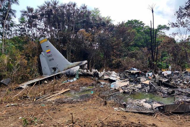 View of the wreckage of the Air Force Hercules aircraft that crashed during takeoff in Puerto Leguizamo, Colombia, near the southern border with Ecuador, on March 24, 2026. The death toll in one of Colombia's worst air accidents in recent history rose to at least 68, an updated tally released on March 24 showed, as the government faulted a "junk" aircraft donated by the United States. (Photo by daniel ortiz / AFP)