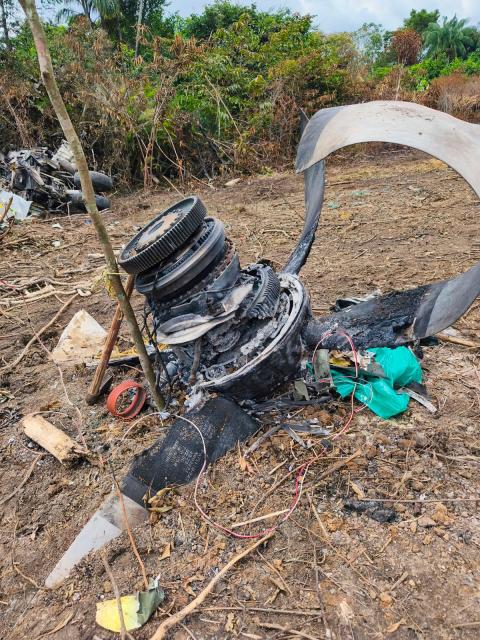 Debris of the Air Force Hercules aircraft that crashed during takeoff are seen in Puerto Leguizamo, Colombia, near the southern border with Ecuador, on March 24, 2026. The death toll in one of Colombia's worst air accidents in recent history rose to at least 68, an updated tally released on March 24 showed, as the government faulted a "junk" aircraft donated by the United States. (Photo by daniel ortiz / AFP)
