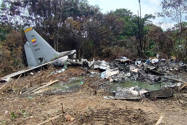 View of the wreckage of the Air Force Hercules aircraft that crashed during takeoff in Puerto Leguizamo, Colombia, near the southern border with Ecuador, on March 24, 2026. The death toll in one of Colombia's worst air accidents in recent history rose to at least 68, an updated tally released on March 24 showed, as the government faulted a "junk" aircraft donated by the United States. (Photo by daniel ortiz / AFP)