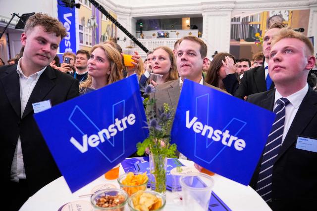 Members of The Liberal Party Venstre react after the first exit polls for the Danish election for the parliament in Copenhagen, Denmark, on March 24, 2026. Danish Prime Minister Mette Frederiksen's Social Democrats and the left-wing bloc took an early lead in Denmark's general election but failed to secure a majority, two exit polls predicted after voting stations closed. (Photo by Bo Amstrup / Ritzau Scanpix / AFP) / Denmark OUT