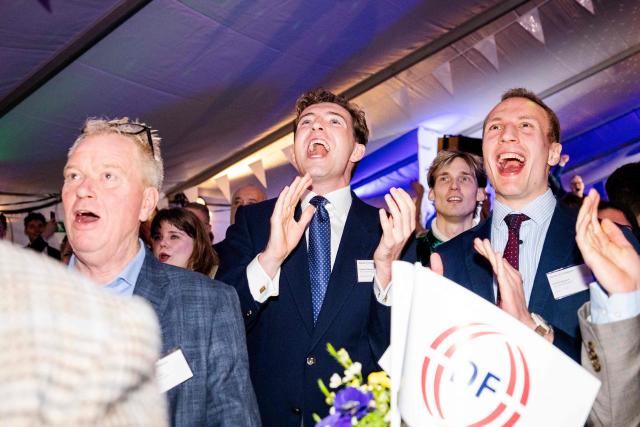 Members of The Danish People's Party react after the first exit polls for the Danish election for the parliament in Copenhagen, Denmark, on March 24, 2026. Danish Prime Minister Mette Frederiksen's Social Democrats and the left-wing bloc took an early lead in Denmark's general election but failed to secure a majority, two exit polls predicted after voting stations closed. (Photo by Sebastian Elias Uth / Ritzau Scanpix / AFP) / Denmark OUT