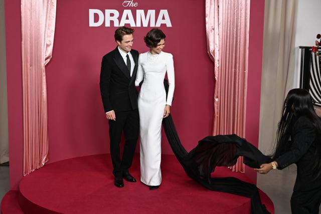 US actress and singer Zendaya and British actor Robert Pattinson get ready before posing during a photocall before the premiere of the film " The Drama" at the Pathe Palace in Paris on March 24, 2026. (Photo by Blanca CRUZ / AFP)