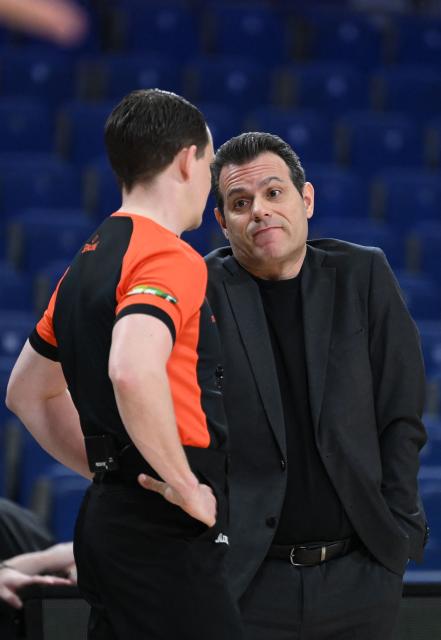 Hapoel IBI Tel Aviv's Greek head coach Dimitris Itoudis gestures during the empty-stadium Euroleague basketball match between Real Madrid Baloncesto and Hapoel IBI Tel-Aviv at the Movistar arena in Madrid on March 24, 2026. (Photo by JAVIER SORIANO / AFP)