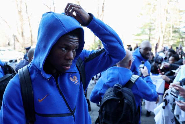 Fance's midfielder Aurelien Tchouameni walks past fans upon arriving at the hotel in Boston on March 24, 2026. France will play two friendly matches against Brazil on March 26 in Boston and against Colombia on March 29 in Landover. (Photo by FRANCK FIFE / AFP)