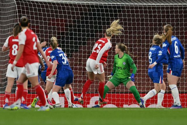 Arsenal's Swedish striker #25 Stina Blackstenius (C) scores the team's first goal during the UEFA Women's Champions League quarter-final 1st leg football match between Arsenal and Chelsea at The Emirates Stadium in London on March 24, 2026. (Photo by Glyn KIRK / AFP)
