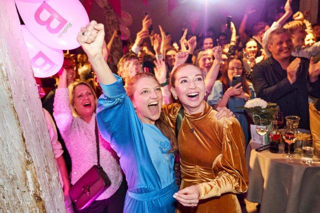 Danish MP Samira Nawa and Zenia Stampe from Denmark's Liberal Party (Venstre) react after the first exit polls for the Danish election for the parliament in Copenhagen, Denmark, on March 24, 2026. Danish Prime Minister Mette Frederiksen's Social Democrats and the left-wing bloc took an early lead in Denmark's general election but failed to secure a majority, two exit polls predicted after voting stations closed. (Photo by Thomas Traasdahl / Ritzau Scanpix / AFP) / Denmark OUT