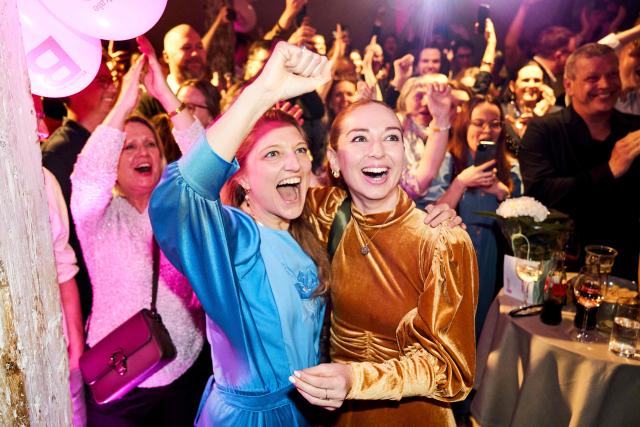 Danish MP Samira Nawa and Zenia Stampe from Denmark's Liberal Party (Venstre) react after the first exit polls for the Danish election for the parliament in Copenhagen, Denmark, on March 24, 2026. Danish Prime Minister Mette Frederiksen's Social Democrats and the left-wing bloc took an early lead in Denmark's general election but failed to secure a majority, two exit polls predicted after voting stations closed. (Photo by Thomas Traasdahl / Ritzau Scanpix / AFP) / Denmark OUT