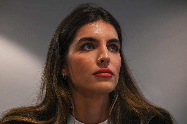 (FILES) Camilla Fabri, the wife of Colombian businessman Alex Saab, who was extradited to the US on money laundering charges, attends a press conference at the Melia hotel in Caracas on March 16, 2023. The wife of the Colombian businessman accused of acting as a front man for the ousted Nicolбs Maduro has officially left Venezuela’s interim government, following the announcement on March 24, 2026, of a new head for the immigration program she had been overseeing. (Photo by Federico PARRA / AFP)