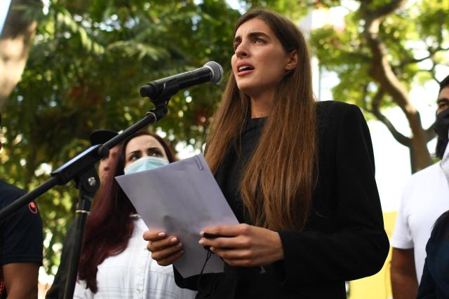 (FILES) Camilla Fabri, the wife of Colombian businessman Alex Saab, who was estradited to the US, speaks during a demonstration demanding his release, at the Bolivar square in Caracas, on October 17, 2021. The wife of the Colombian businessman accused of acting as a front man for the ousted Nicolбs Maduro has officially left Venezuela’s interim government, following the announcement on March 24, 2026, of a new head for the immigration program she had been overseeing. (Photo by Federico PARRA / AFP)