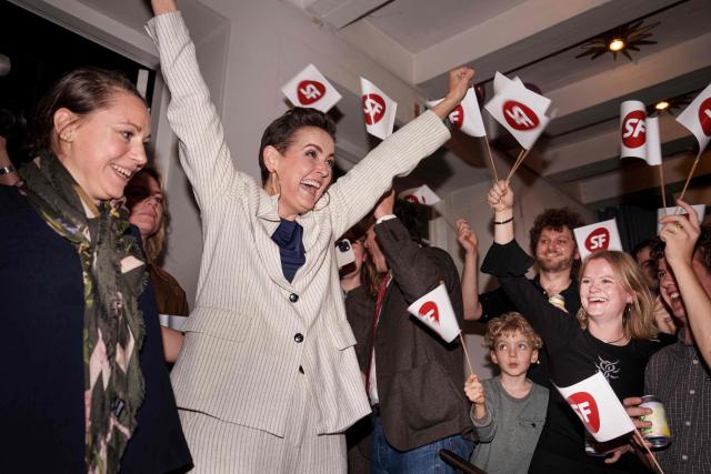 Pia Olsen Dyhr, chairwoman of the Socialist People's Party celebrates with supporters at the party's election celebration after the first exit polls for the Danish election for the parliament at Johan Borup's Folk High School in Copenhagen, Denmark, on March 24, 2026. (Photo by Liselotte Sabroe / Ritzau Scanpix / AFP) / Denmark OUT