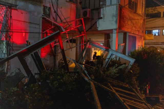 This photograph shows damage at the site where a building was struck by a projectile in Bnei Brak, on the eastern outskirts of Tel Aviv, on March 24, 2026. The Middle East was sparked by joint US-Israeli strikes on Iran that triggered a wave of retaliatory missile and drone attacks against Israel and several other countries in the region. (Photo by Ilia YEFIMOVICH / AFP) / 