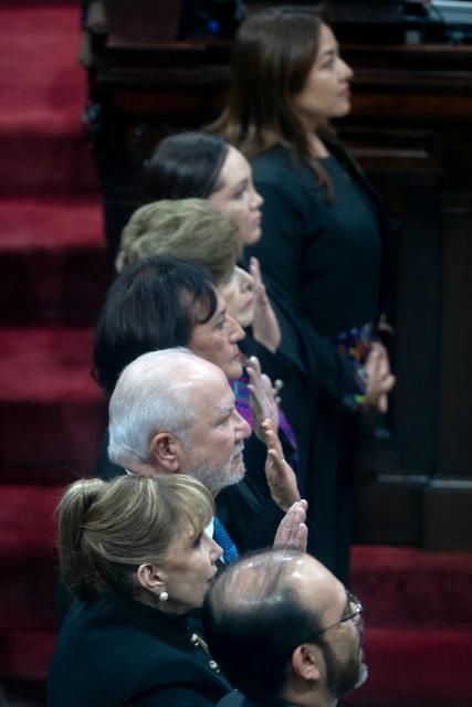 Guatemalan magistrate Roberto Molina Barreto swears an oath along other magistrates at the Constitutional Court in Guatemala City on March 24, 2026. (Photo by Edwin BERCIAN / AFP)