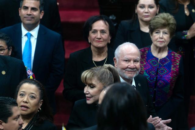 Guatemalan magistrate Roberto Molina Barreto greets congressional deputies before his swearing-in at the Constitutional Court in Guatemala City on March 24, 2026. (Photo by Edwin BERCIAN / AFP)