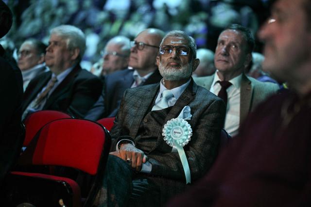 People attend a Reform UK party local election campaign rally in Leeds, northern England on March 24, 2026. (Photo by Oli SCARFF / AFP)