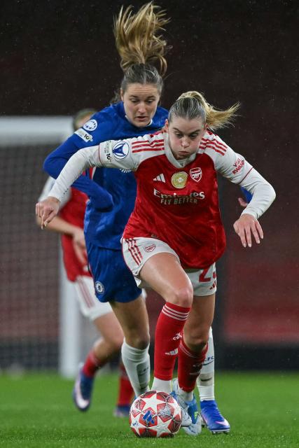 Arsenal's English striker #23 Alessia Russo (front) is challenged by Chelsea's Dutch midfielder #18 Wieke Kaptein (behind) during the UEFA Women's Champions League quarter-final 1st leg football match between Arsenal and Chelsea at The Emirates Stadium in London on March 24, 2026. (Photo by Glyn KIRK / AFP)