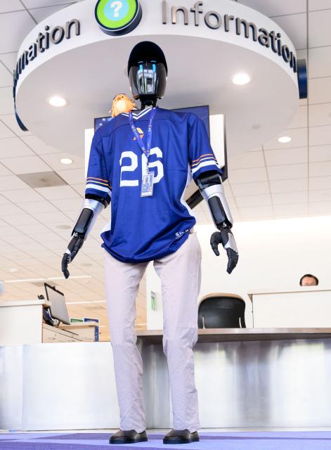 An AI-powered robot named Jose that greets travelers, answers questions and provides real-time information is displayed during a media event at San Jose Mineta International Airport in San Jose, California, on March 24, 2026. Developed by local AI startup IntBot, the robot is part of a four-month engagement with SJC and will be stationed in Terminal B, Gate 24. Jose is designed to greet travellers and answer questions while providing real-time information in over 50 languages. (Photo by JOSH EDELSON / AFP)