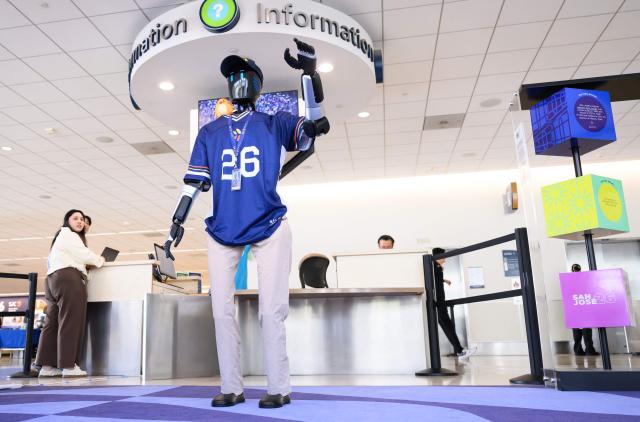 An AI-powered robot named Jose that greets travelers, answers questions and provides real-time information is displayed during a media event at San Jose Mineta International Airport in San Jose, California, on March 24, 2026. Developed by local AI startup IntBot, the robot is part of a four-month engagement with SJC and will be stationed in Terminal B, Gate 24. Jose is designed to greet travellers and answer questions while providing real-time information in over 50 languages. (Photo by JOSH EDELSON / AFP)