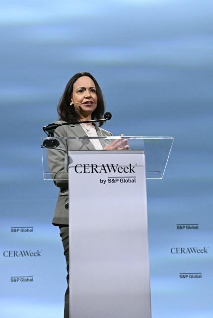 Venezuelan opposition leader Maria Corina Machado speaks during 2026 CERAWeek by S&P Global energy conference in Houston, Texas, on March 24, 2026. Machado told AFP on Tuesday that her country's formerly all-powerful socialist ideology has been fatally "wounded" by US President Donald Trump. The regime known as "Chavismo" that held Venezuela in its grip for a quarter of a century under Hugo Chavez and his successor Nicolas Maduro is "wounded irreparably and is being dismantled," Machado said. (Photo by RONALDO SCHEMIDT / AFP)