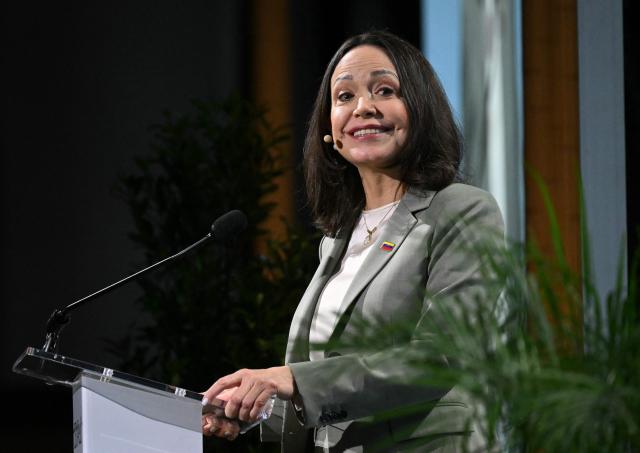 Venezuelan opposition leader Maria Corina Machado speaks during 2026 CERAWeek by S&P Global energy conference in Houston, Texas, on March 24, 2026. Machado told AFP on Tuesday that her country's formerly all-powerful socialist ideology has been fatally "wounded" by US President Donald Trump. The regime known as "Chavismo" that held Venezuela in its grip for a quarter of a century under Hugo Chavez and his successor Nicolas Maduro is "wounded irreparably and is being dismantled," Machado said. (Photo by RONALDO SCHEMIDT / AFP)