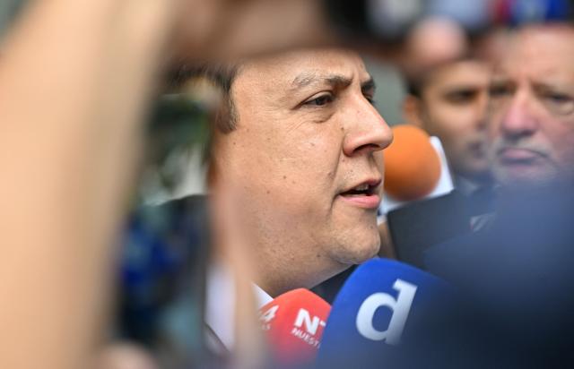 Venezuelan political activist Javier Tarazona speaks to the media outside the Justice Palace in Caracas on March 24, 2026. A Venezuelan court refused to grant an amnesty to renowned activist Javier Tarazona on March 24, 2026, who was released on parole on February 1 after four years incarcerated for "terrorism" and "treason." (Photo by Juan BARRETO / AFP)