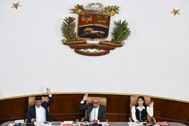 Venezuela's National Assembly President Jorge Rodriguez (C), First Vice President Pedro Infante (L), and Second Vice President America Perez attend a session at the National Assembly in Caracas on March 24, 2026. (Photo by Juan BARRETO / AFP)